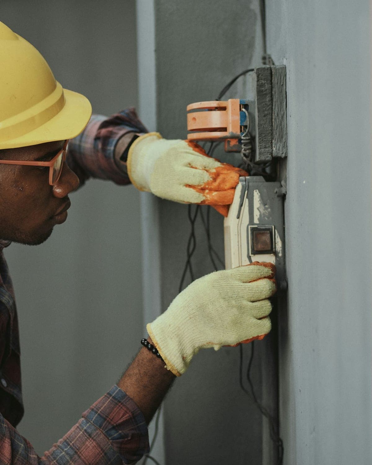 Professional home inspector examining an electrical meter during a residential home inspection