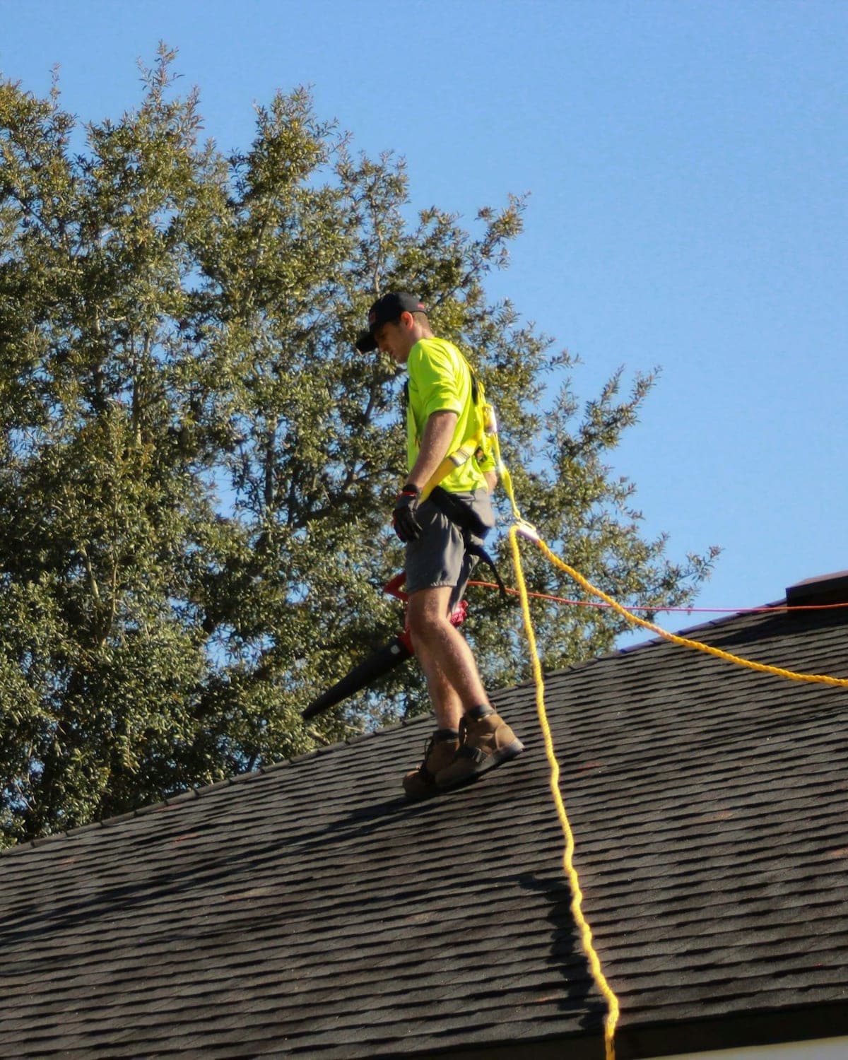 Home inspector examining a residential roof during a home inspection