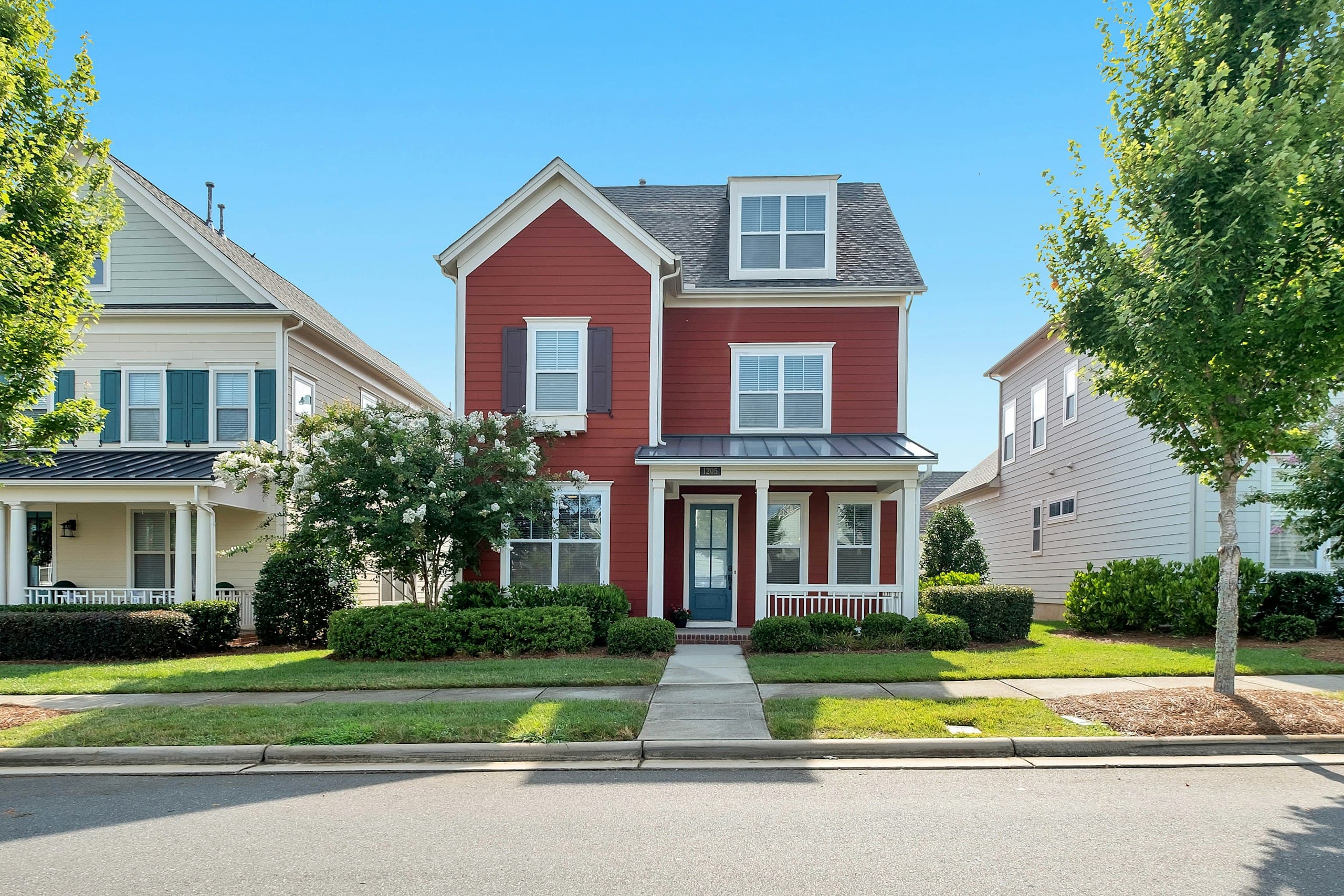 Residential homes along a tree-lined street